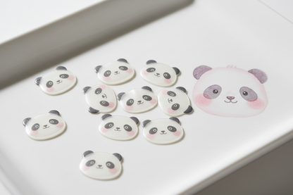 Cute panda-shaped hydrocolloid acne patches arranged on a white surface with soft pastel pink tones