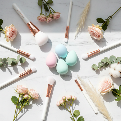 Zynerae Makeup Sponge and Brush Set flat lay on white marble with botanicals